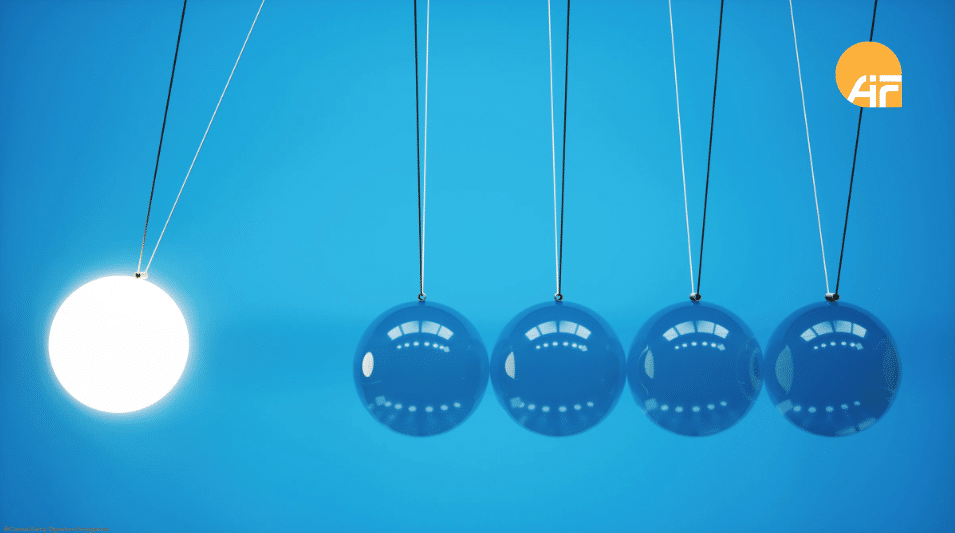 Fünf Kugeln, die hängen, eine Kugel leuchtet.